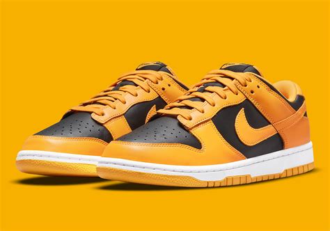 nike dunk goldenrod|yellow and black dunks low.